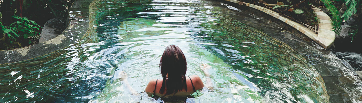 Woman soaking in hot springs