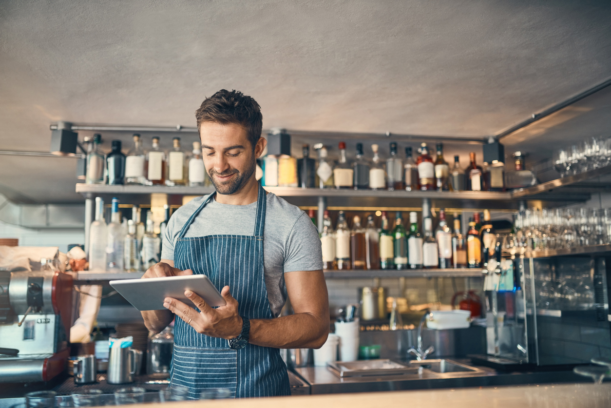 franchisee looking at an iPad