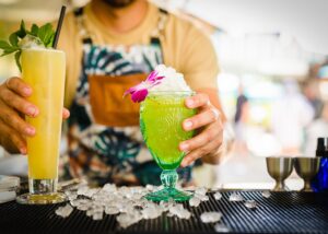 bartender handing cocktails